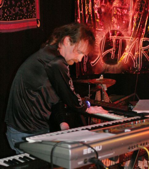 Rob playing with crossed hands