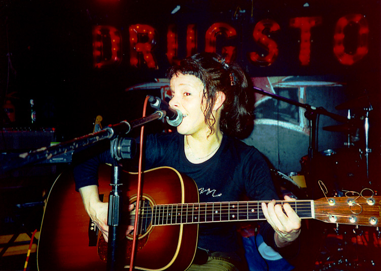 Isabel on acoustic guitar