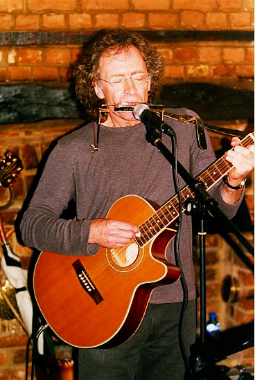 Dany on harmonica and guitar