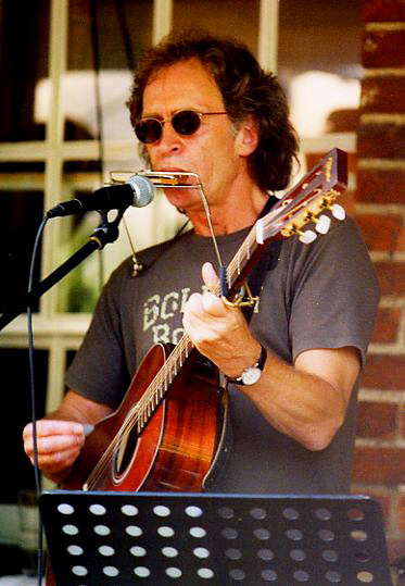 Dany on harmonica and guitar