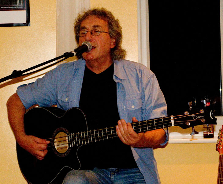 Chas with 12-string acoustic guitar and bass pedals